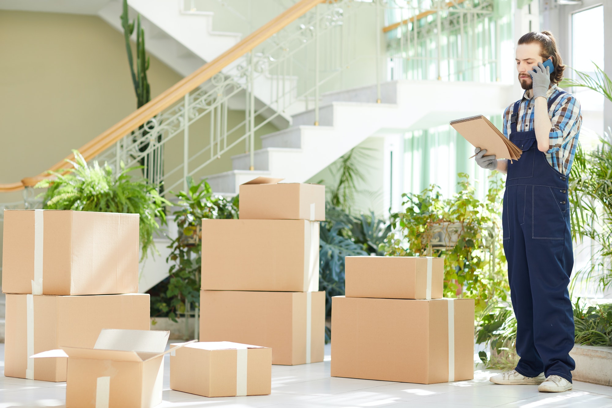 busy-moving-expert-calling-to-report-about-delivery.jpg